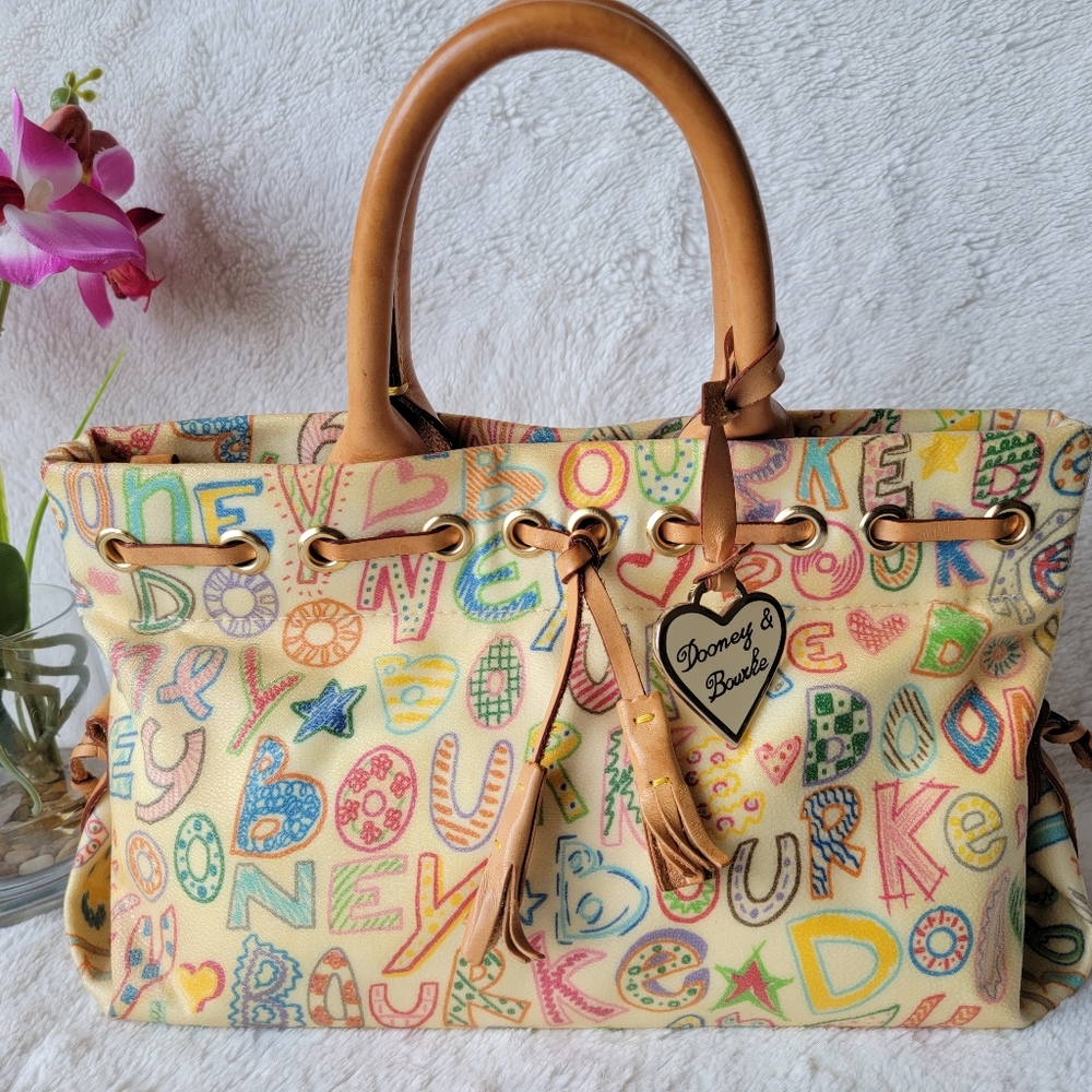 EUC Dooney & Bourke Signature Tassel Top Handle Hand Bag Ivory / Tan